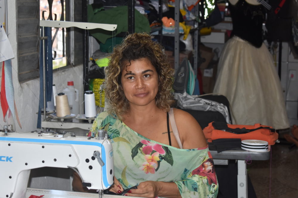 A seamstress at La de Favelinha