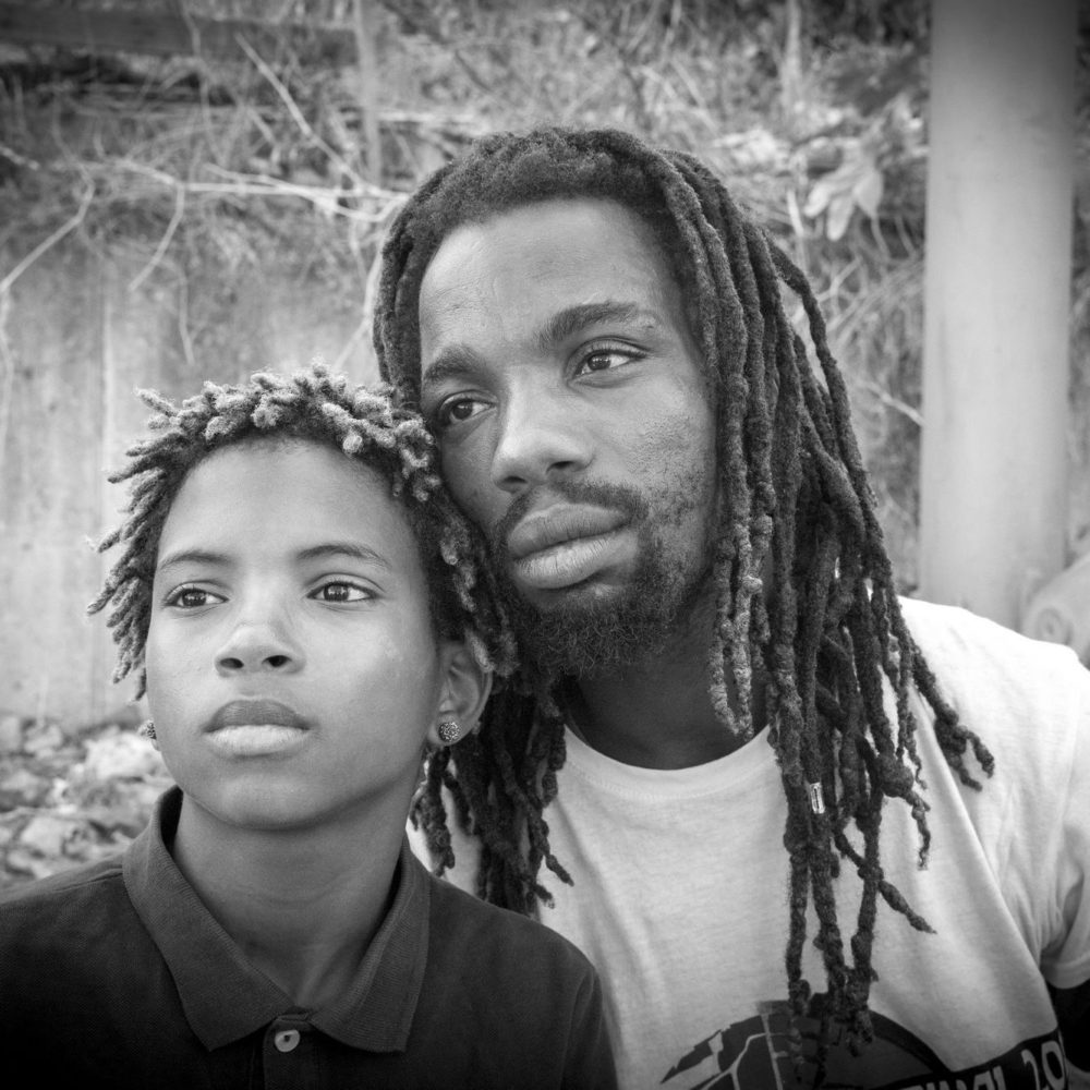 Mima, our guide in Cova da Moura, with his son.