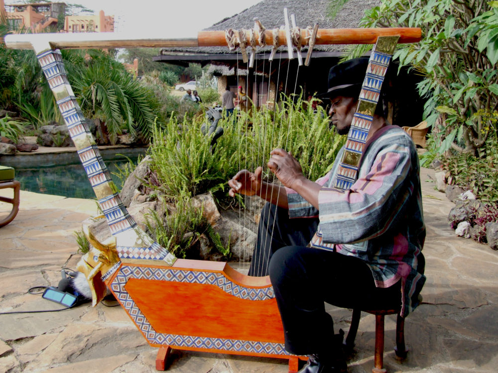 Ayub Ogada with giant nyatiti