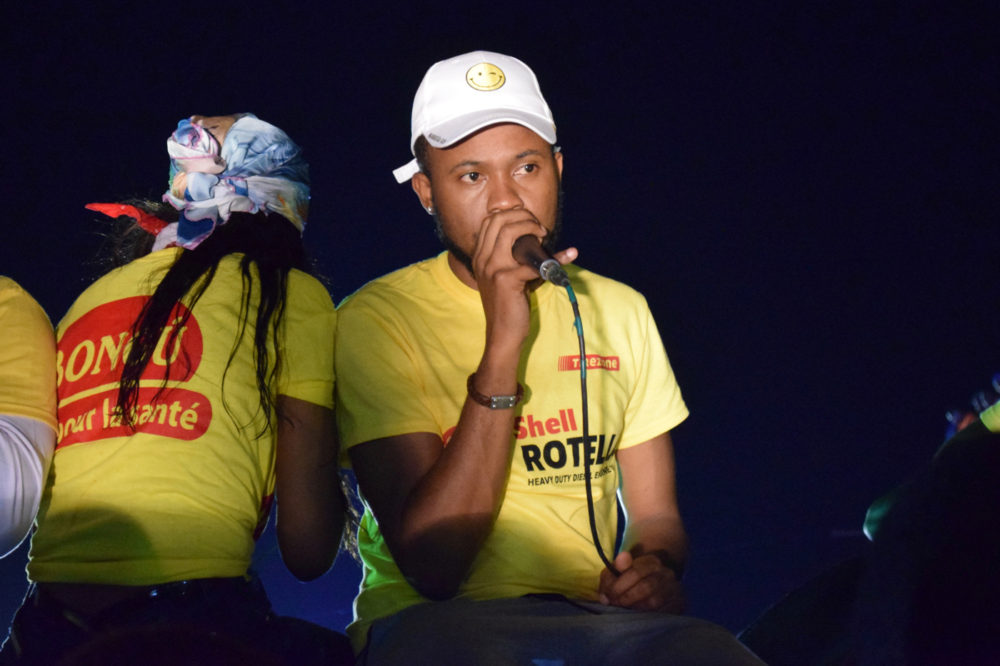 Roody Roodboy sings from the front of the float. He has a long night ahead, so he is sitting down for now.