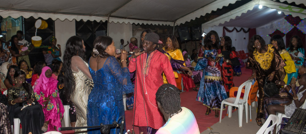 Noumoucounda and Gounda performing at a street wedding