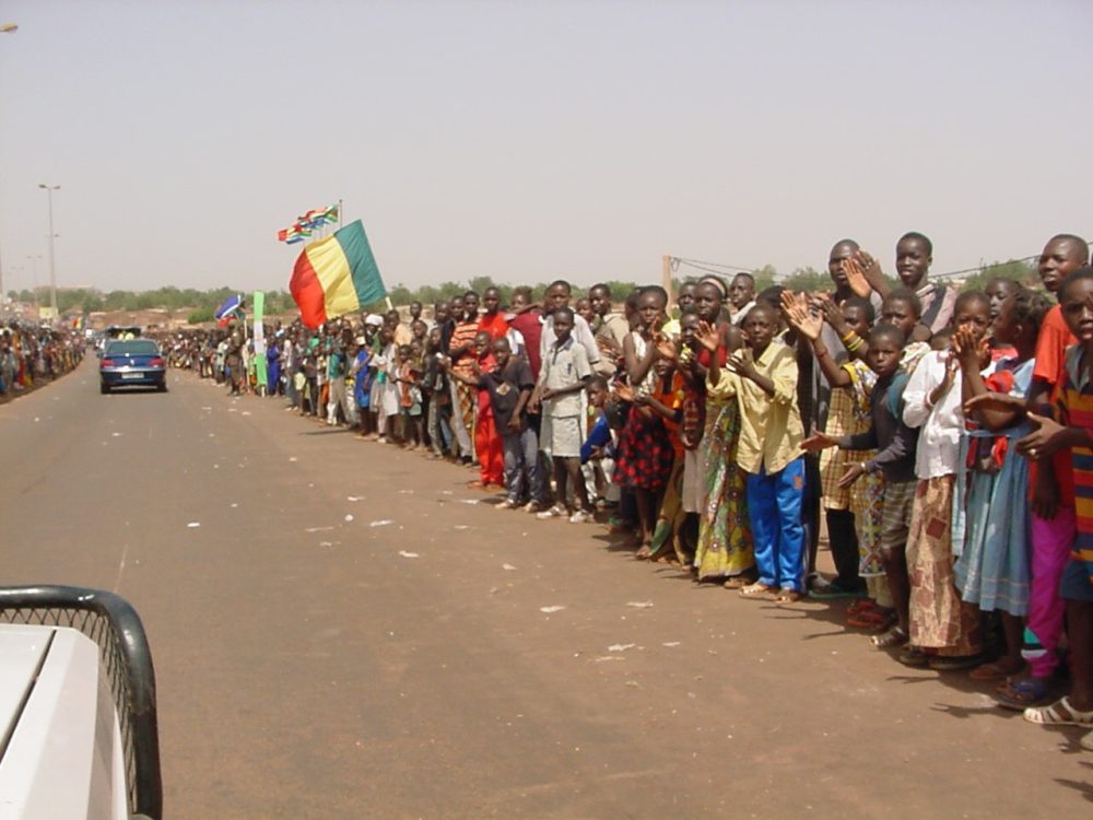 Crowd greeting Baba Sora's return from travels...