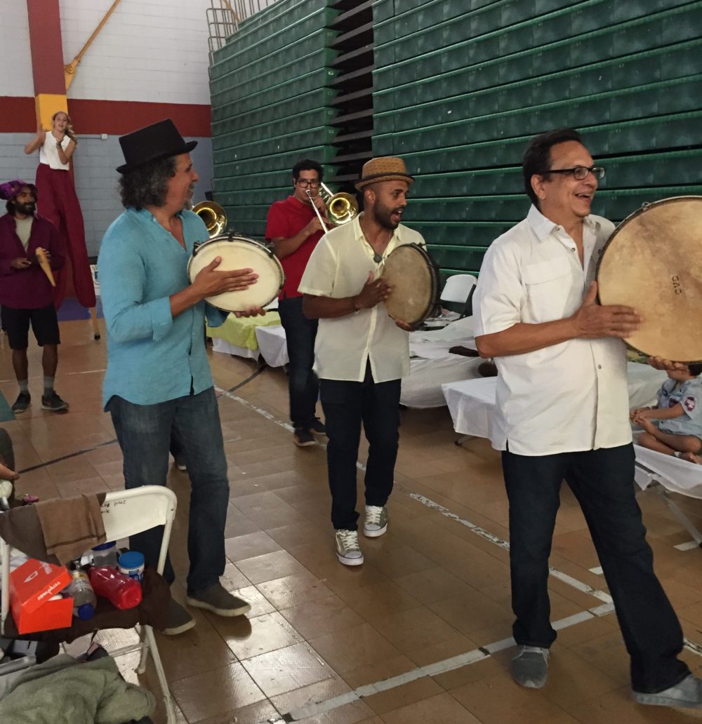 Plena Libre performing in a community center for victims of Hurricane Maria (photo courtesy of Valerie Cox)