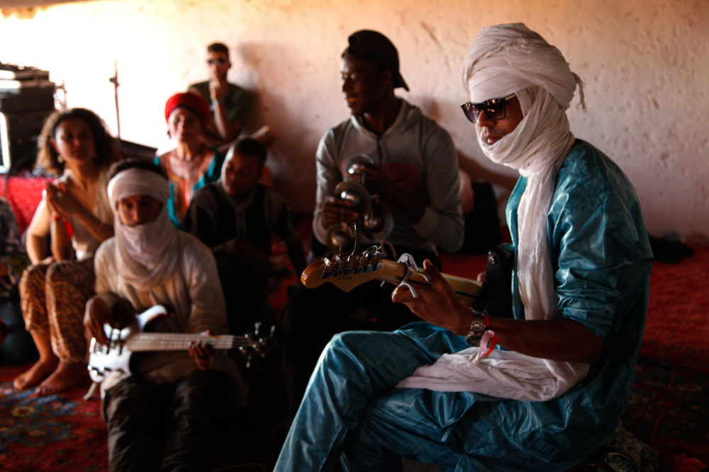 Young musicians from the local Joudour Sahara music school jam in the afternoon at Taragalte.