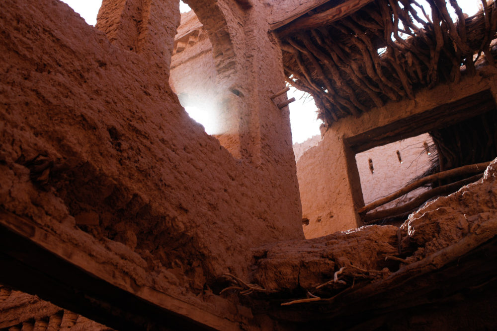 The crumbling, abandoned remains of a huge old family kasbah near the festival grounds. Sand dunes are slowly swallowing it and the nearby, still-inhabited town.