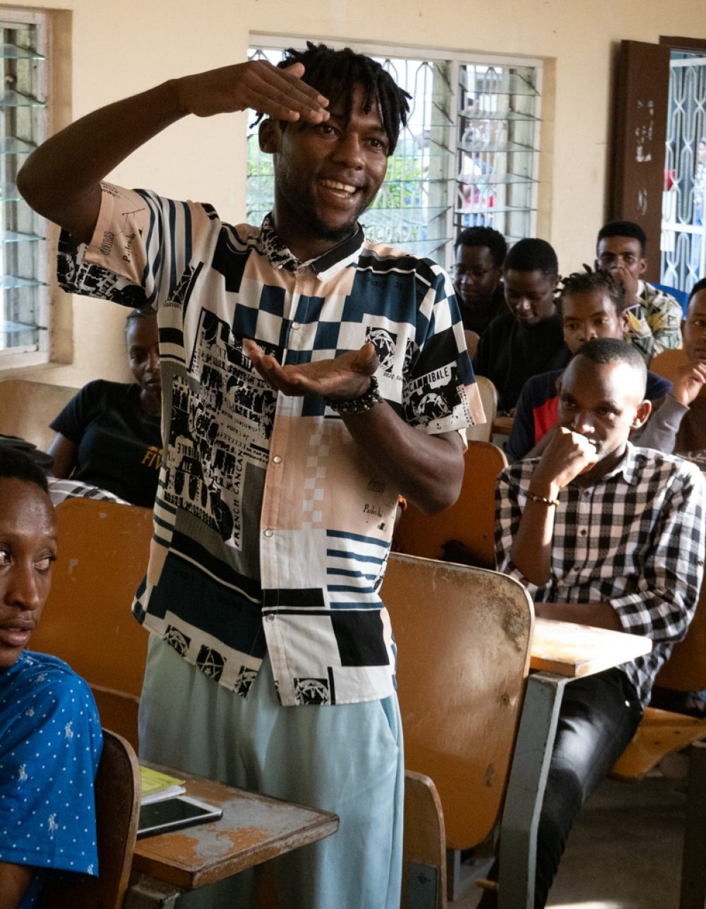 U of Dar music student performs for the class