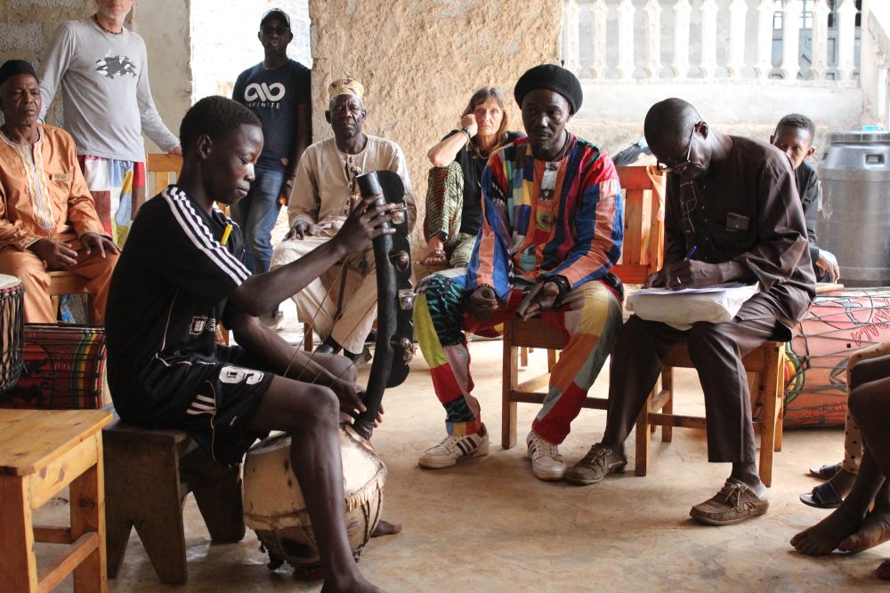 Teachers evaluating a student: Mamady Mansare, Thomas Vahle, Momo Sylla, Baba Galle Barry, Nadine Haguet, Bouba Mbeng, Mohamed Mmah Camara and Djamady Kouyate (behind).  Photo by Sidiki Camara