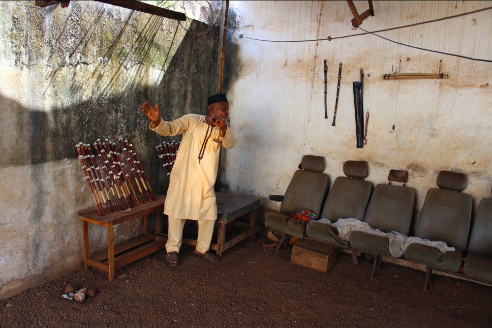 Mamady Mansaré in the workshop corner of his courtyard.  Photo by Sylvain Leroux