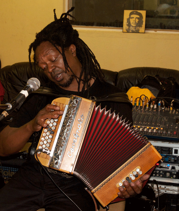 Rossy in his studio with his digital accordion. (Eyre 2014)