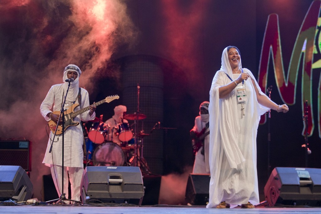 Amanar featuring guitarist Ahmed Ag Kaedy from Kidal, and vocalist/dancer Mariam Walet Messaoud. Ahmed's short guitar lines, repeated but ending at different points matched the rhythm of Mariam's deliberate dance steps as her left foot stepped followed by her right, creating a feeling of moving slowly through a vast space. photo William Farrington