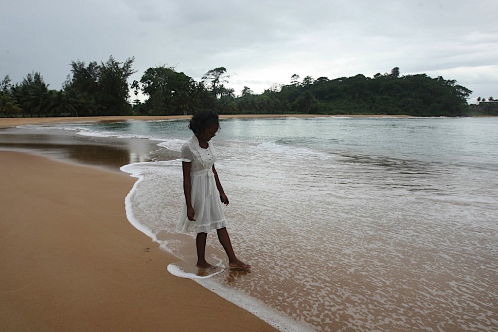 A woman walking along Grand Bereby beach in western Cote d'Ivoire. photo William Farrington