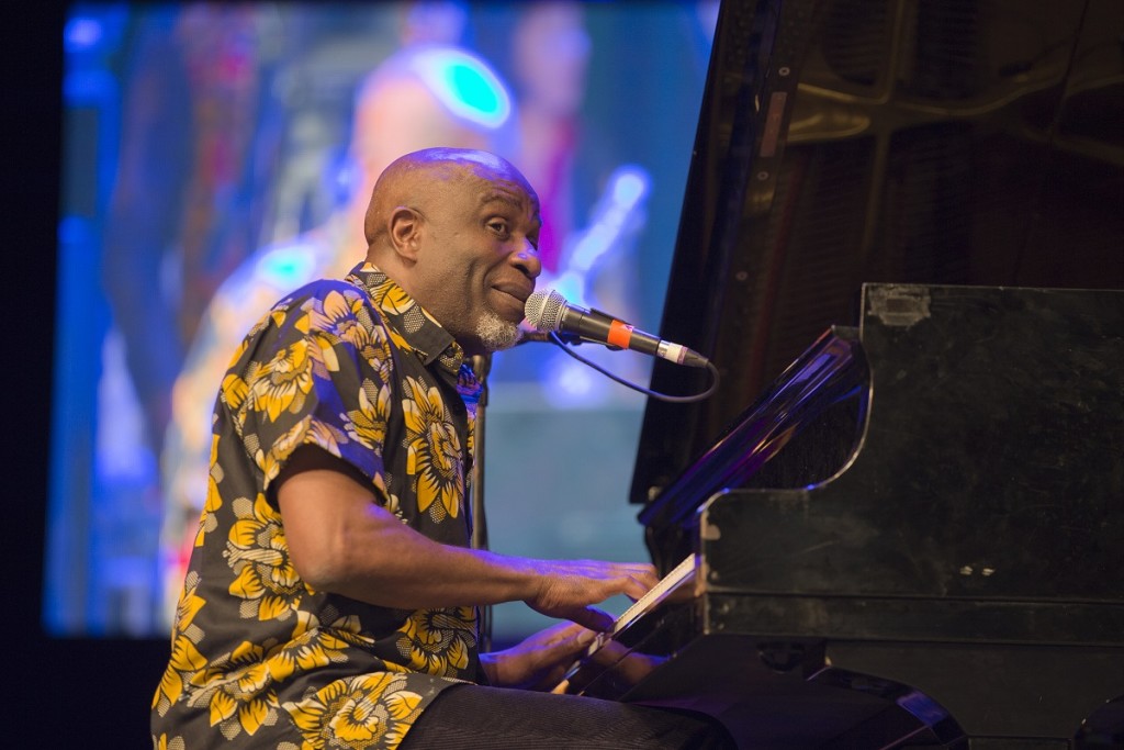 Ray Lema sitting at the piano during the opening performance at the Soirée Jazz in the Palais de la Culture, wednesday. Ray's all star quartet played a set of acoustic jazz sans rhythm or horn sections, featuring engaging harmonies and guitar interplay . Unfortunately technical problems led to an over two hour delay pushing some of the artists off the bill photo William Farrington