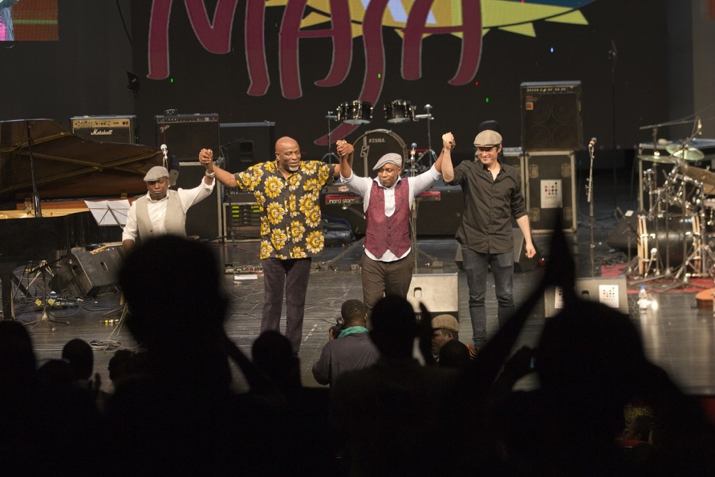 Ray Lema and Ballou Canta center, take a bow to a standing ovation at the Palais de la Culture following their performance at the Soirée Jazz , wednesday. photo William Farrington