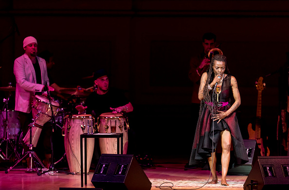 Spanish composer and singer Buika (born Maria Concepcion Balboa Buika, aka Concha Buika) performs with her band with Ahmed King Barroso (white cap) on percussion, Alexis 'Pututi' Arce on congas, and Santiago Canada Valverde on trombone at Carnegie Hall, New York, New York, April 26, 2016. Buika's parents are from Equatorial Guinea in Africa. (Photo by Jack Vartoogian/Getty Images)