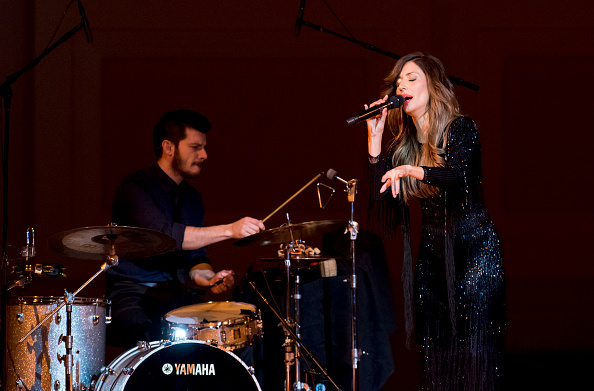 Portuguese fado singer Ana Moura (born Ana Claudia Moura Pereira) performs with her band at Carnegie Hall, New York, New York, April 26, 2016. With her is Mario Costa on drums. (Photo by Jack Vartoogian/Getty Images)