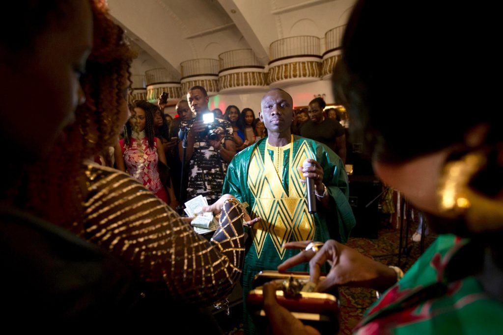 Papa Diouf getting sprayed with dollar bills as he and his band la Generation Consciente palyed the Alhambra Ballroom in Harlem. presented by New African Productions, saturday July 10th.