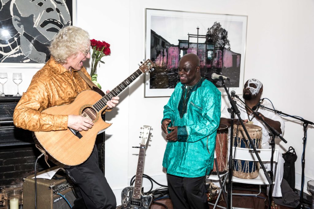 Banning Eyre (guitar) performs with Samba Mapangala and Joseck Asikoye (percussion)