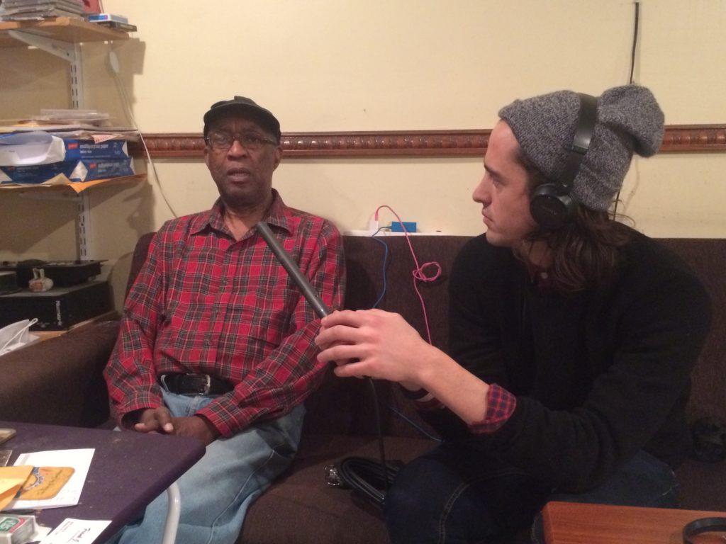 Neville Bush speaking with producer Saxon Baird. 