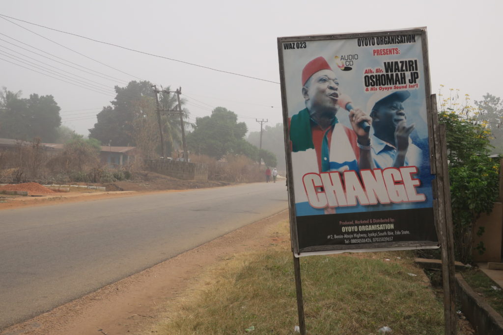 A signboard for Alhaji Waziri Oshomah's album Change, pictured with Adams Oshiomole